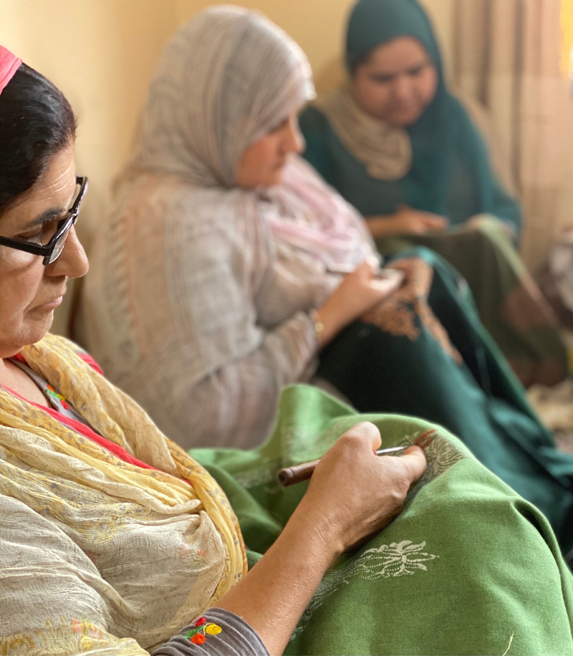 Kashmiri artisans practising Aari embroidery in Rainawari, Srinagar